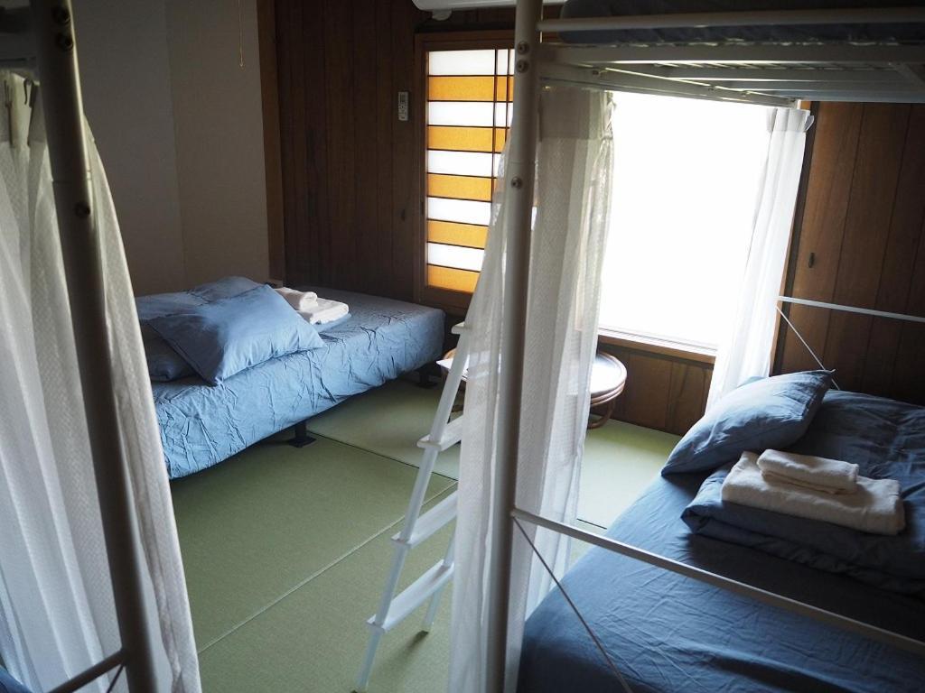 Guesthouse ＆ Beach Cafe Fuego Hyuga Номер фото